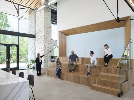 Office grand stands, people sitting on steps with natural light
