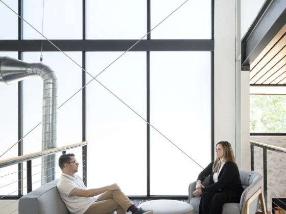 office lounge area with frosted glass behind